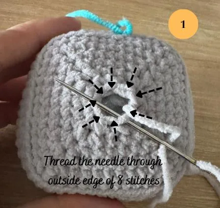 Thread the needle through the outside edge of 8 stitches