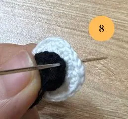 Sewing the black part onto the white