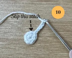 Skip one stitch after the first arm