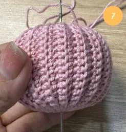 Pulling the yarn through the center
